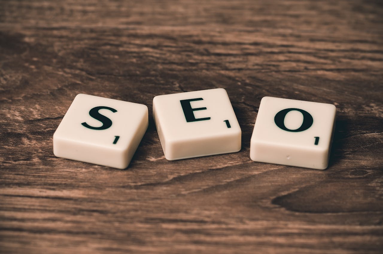 gallery-05 Scrabble tiles spelling SEO on a wooden surface. Ideal for digital marketing themes.